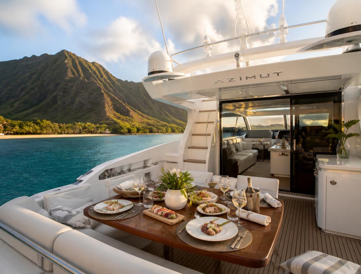 Placeholder — gourmet lunch set on the teak deck of a luxury Azimut yacht off Oahu